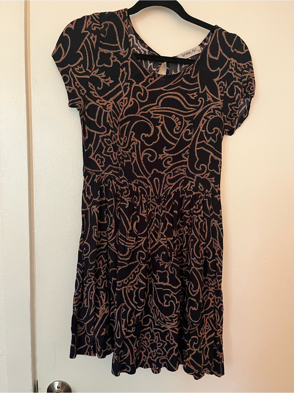 Anthropologie Black Mini Dress with Tan Floral Swirl Pattern